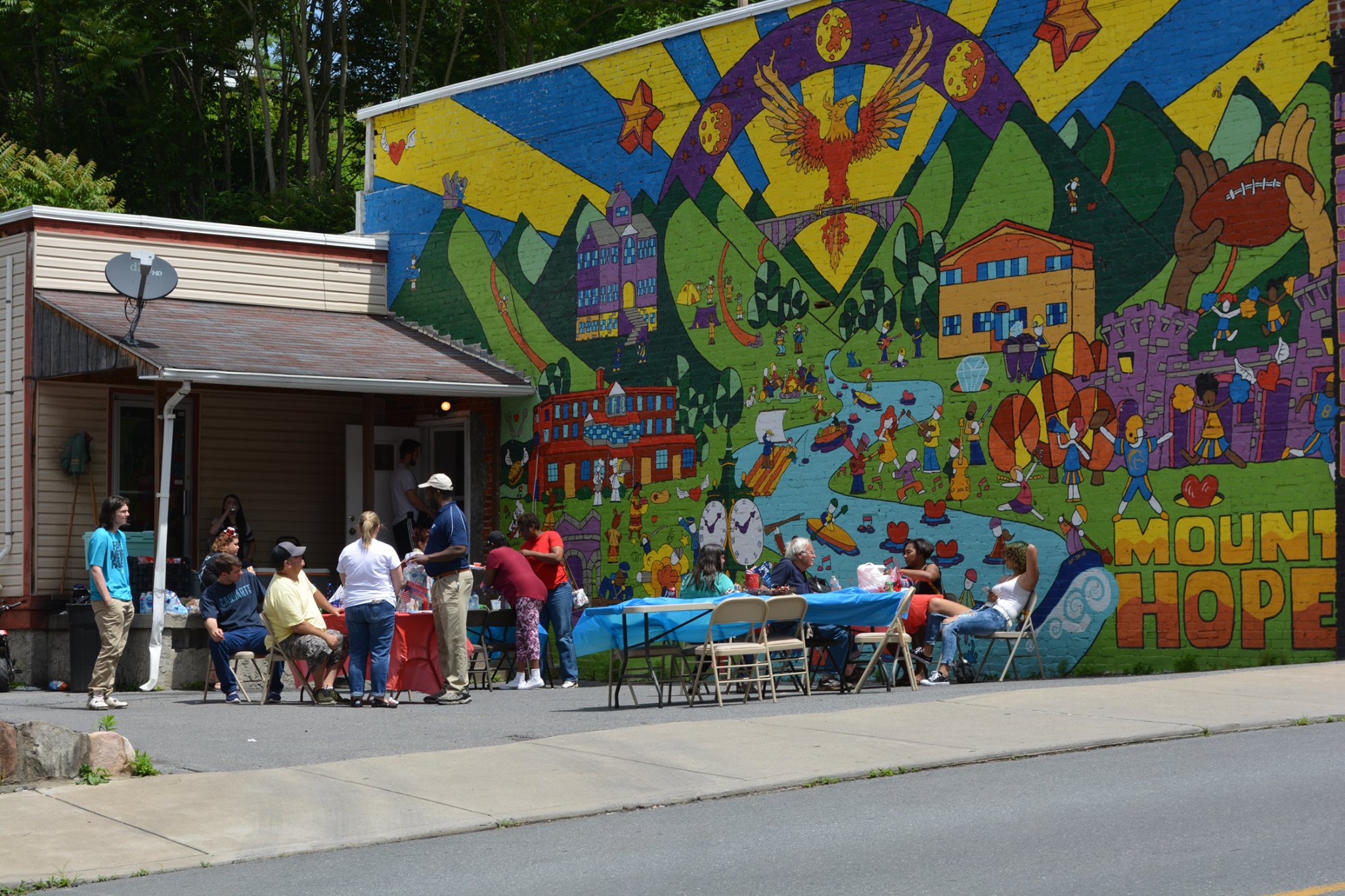 Community gathering at Phoenix Wings Mural